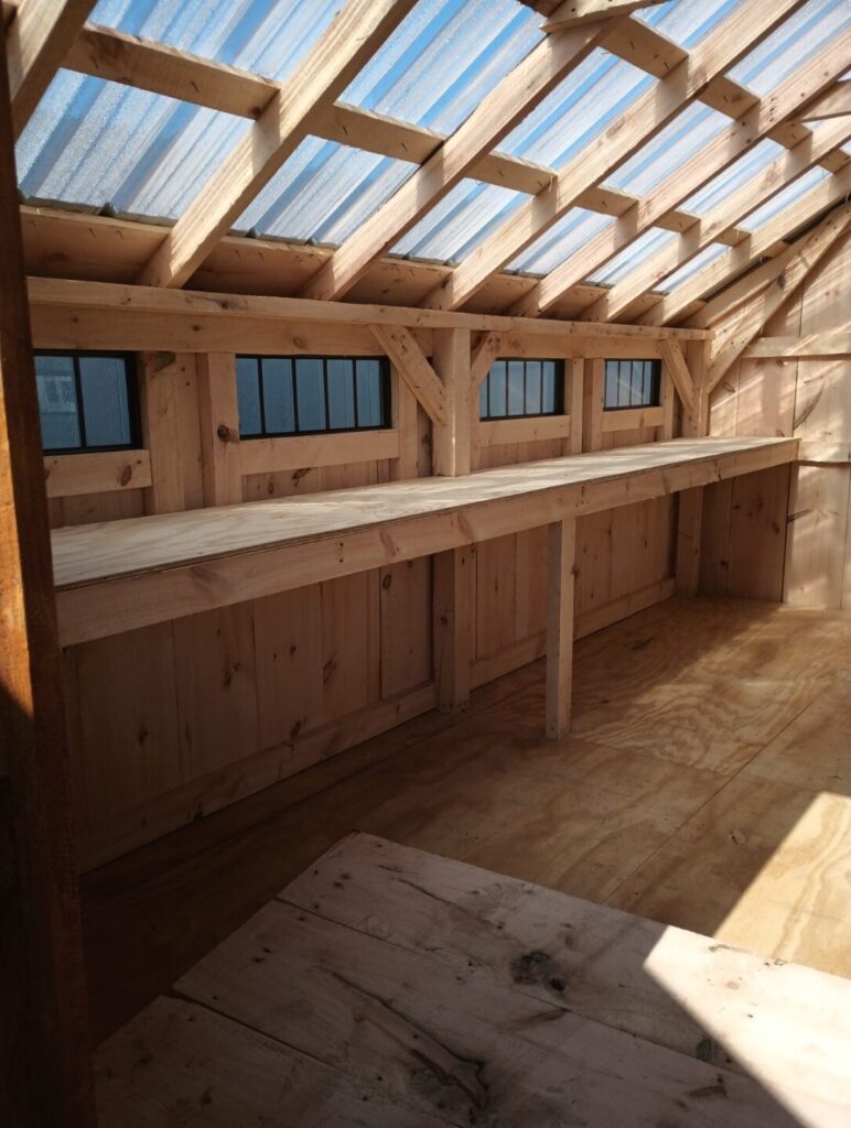 Custom Amish-built shed with shelving for craft supplies, potted plants, or anything else that requires storage and organization