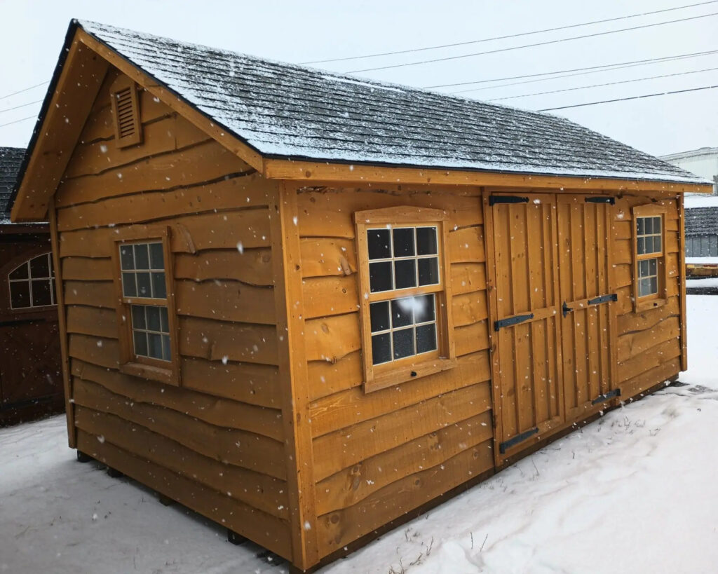 Amish-built storage shed covered with a dusting of snow in the winter